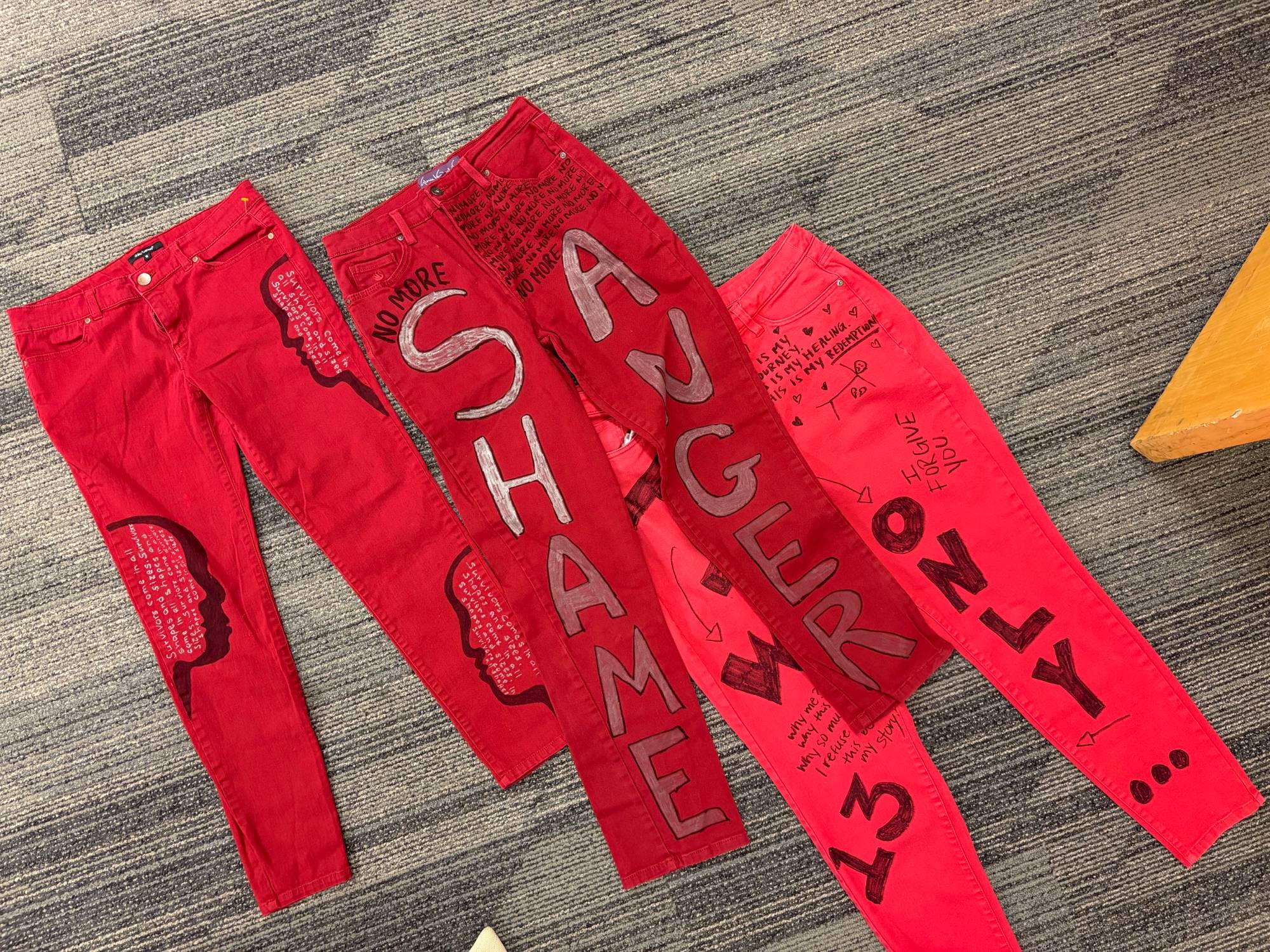 red jeans with words